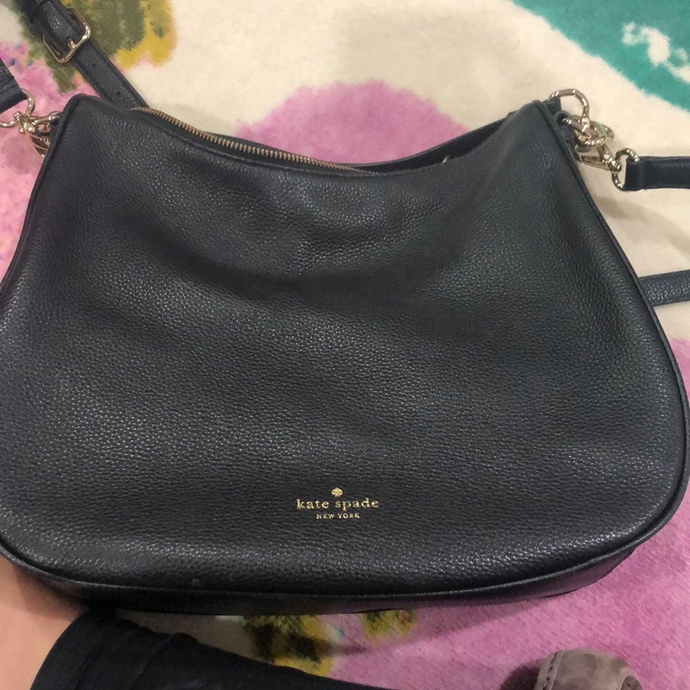 Kate Spade crossbody and can be worn over shoulder